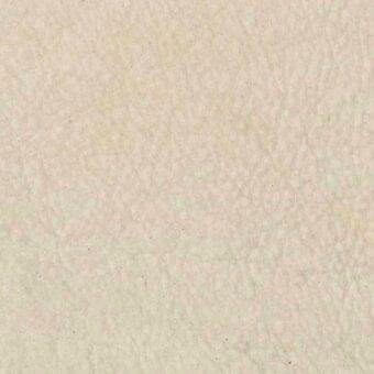 Nubuck leather rug, warm beige tone, smooth texture with subtle mottled variations and gentle pile, consistent with Rugiano brand.